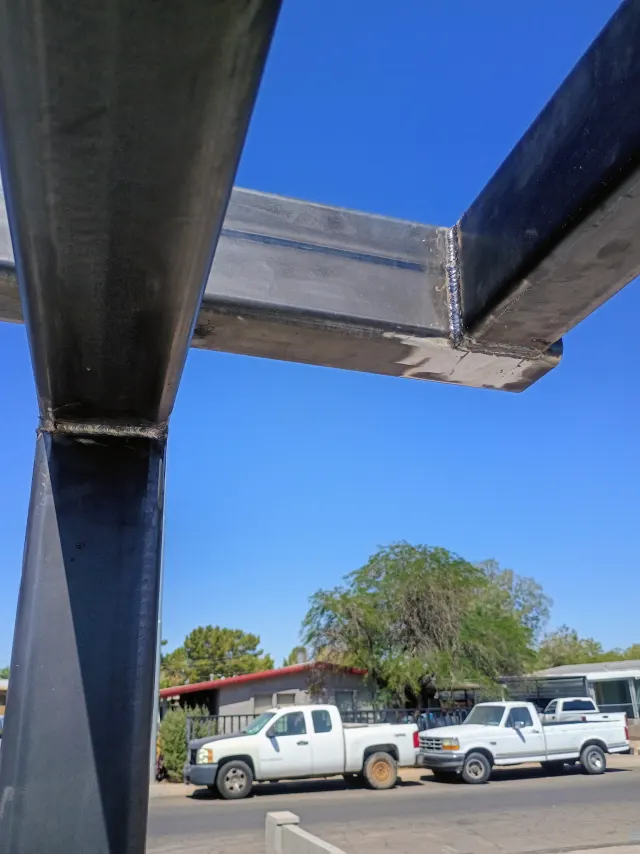 Close-up of clean welds where two steel tubes meet
